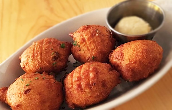 Salt + Smoke signature dishes Hushpuppy, Mac and Cheese, St. Louis-Style Ribs, Brisket Sandwich, Deviled Eggs.